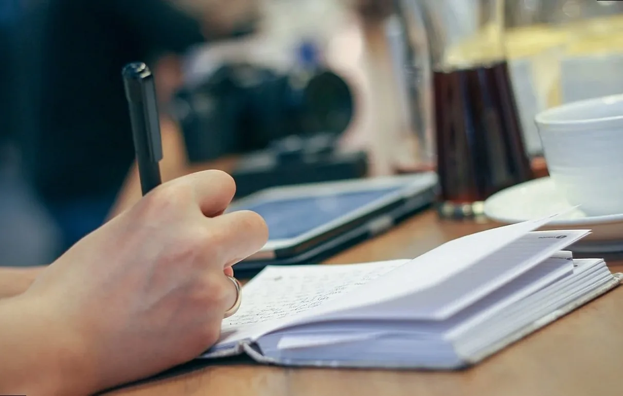 hand, write, pen, notebook, journal, planner, writing, paper, pages, open notebook, notes, desk, person, work, working, 